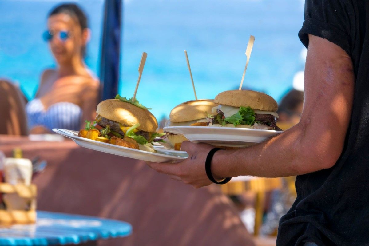 burgers being served at a beachfront restaurant
